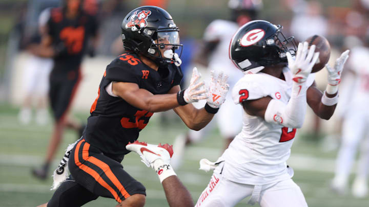 Glenville intercepts a pass intended for Massillon in the first half at Paul Brown Tiger Stadium. Friday, August 22, 2025.