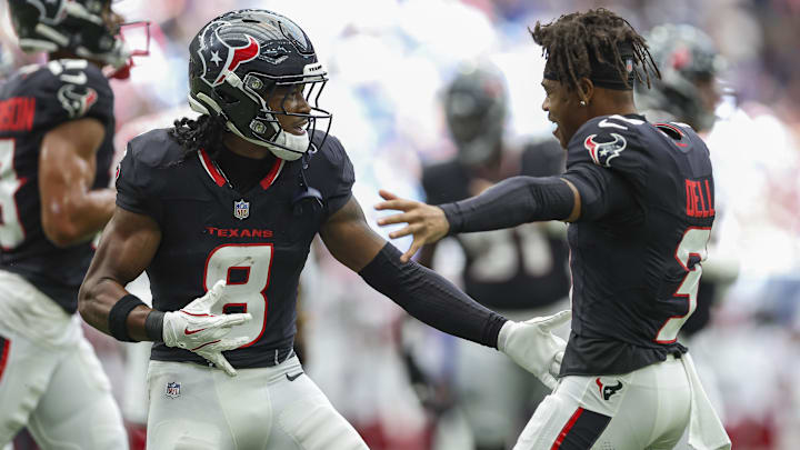 Houston Texans wide receiver John Metchie III (8) and wide receiver Tank Dell (3)