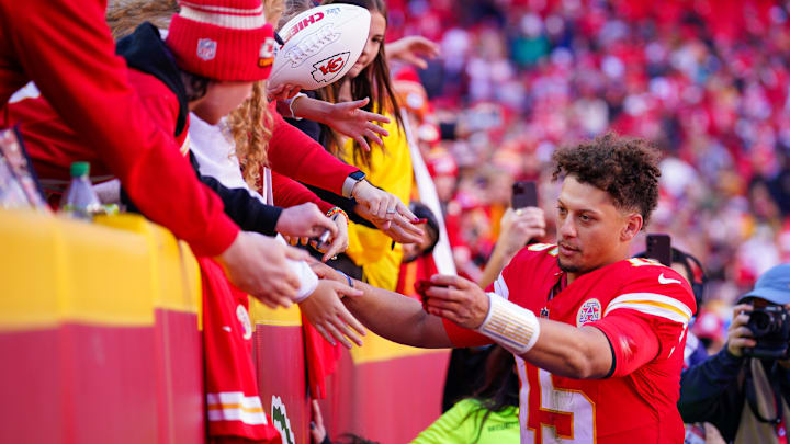 Nov 10, 2024; Kansas City, Missouri, USA; Kansas City Chiefs quarterback Patrick Mahomes (15) greets fans as he leaves the field after the win over the Denver Broncos at GEHA Field at Arrowhead Stadium. Mandatory Credit: Denny Medley-Imagn Images