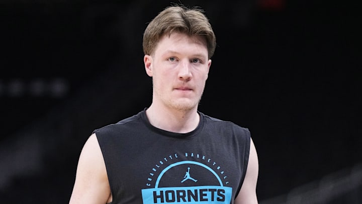 Jan 2, 2026; Milwaukee, Wisconsin, USA; Charlotte Hornets guard Kon Knueppel (7) walks onto the court during pregame warm ups before a game against the Milwaukee Bucks at Fiserv Forum. Mandatory Credit: Michael McLoone-Imagn Images