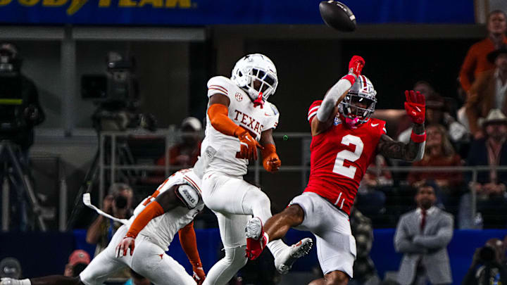 Ohio State receiver Emeka Egbuka has a catch broken up by Texas Longhorns defensive back Jahdae Barron (7) in the Cotton Bowl. Barron finished the season with 46 solo tackles, five interceptions and 11 passes defended.
