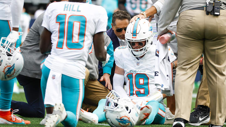 Sep 22, 2024; Seattle, Washington, USA; Miami Dolphins quarterback Skylar Thompson (19) receives medical attention after suffering an injury during the third quarter against the Seattle Seahawks at Lumen Field. Mandatory Credit: Joe Nicholson-Imagn Images