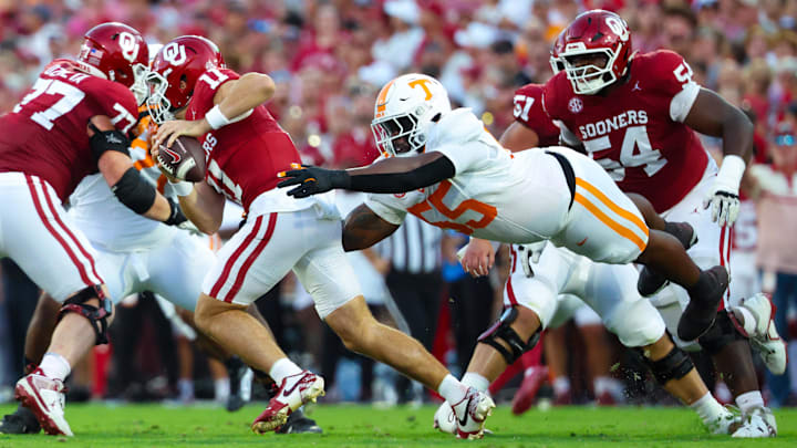 Sep 21, 2024; Norman, Oklahoma, USA;  Tennessee Volunteers defensive lineman Omarr Norman-Lott (55) dives for Oklahoma Sooners quarterback Jackson Arnold (11) during the first half at Gaylord Family-Oklahoma Memorial Stadium. 