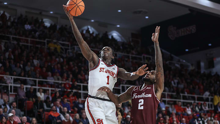 Nov 4, 2024; Queens, New York, USA;  St. John's Red Storm guard Kadary Richmond (1) drives past Fordham Rams forward Romad Dean (2) in the second half at Carnesecca Arena. Mandatory Credit: Wendell Cruz-Imagn Images
