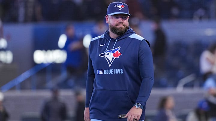 Mar 31, 2025; Toronto, Ontario, CAN; Toronto Blue Jays manager John Schneider (14) celebrates defeating the Washington Nationals  at Rogers Centre. 
