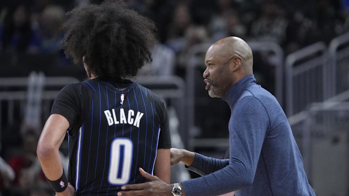 Orlando Magic head coach Jamahl Mosely gives instructions to guard Anthony Black (0) in the first half against the Milwaukee Bucks at Fiserv Forum.