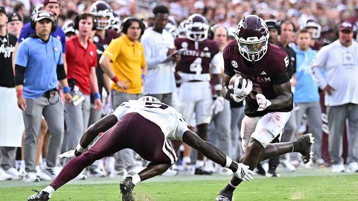 Missouri State Bears cornerback Malik Ganaway (7) attempts to tackle Texas A&M Aggies wide receiver Terry Bussey (6) during the second quarter at Kyle Field. Missouri State Bears cornerback Malik Ganaway (7) attempts to tackle Texas A&M Aggies wide receiver Terry Bussey (6) during the second quarter at Kyle Field.