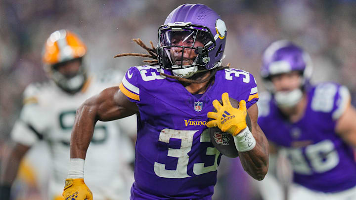 Dec 29, 2024; Minneapolis, Minnesota, USA; Minnesota Vikings running back Aaron Jones (33) runs with the ball against Green Bay Packers in the third quarter at U.S. Bank Stadium. Dec 29, 2024; Minneapolis, Minnesota, USA; Minnesota Vikings running back Aaron Jones (33) runs with the ball against Green Bay Packers in the third quarter at U.S. Bank Stadium.