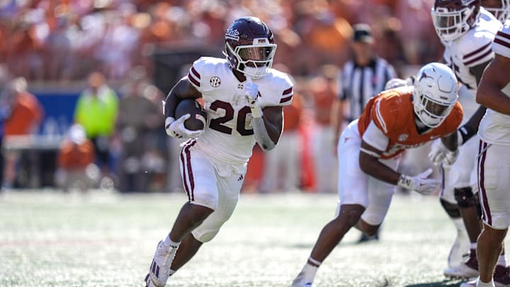 Sep 28, 2024; Austin, Texas, USA;  Mississippi State Bulldogs running back Johnnie Daniels (20) runs the ball in the first half against the Texas Longhorns at Darrell K Royal-Texas Memorial Stadium. Mandatory Credit: Daniel Dunn-Imagn Images
