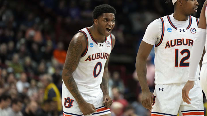 Mar 22, 2024; Spokane, WA, USA; Auburn Tigers guard K.D. Johnson (0) reacts after a basket against