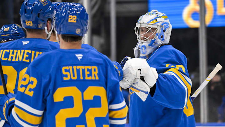 Dec 12, 2025; St. Louis, Missouri, USA; St. Louis Blues goaltender Joel Hofer (30) celebrates with teammates after the Blues defeated the Chicago Blackhawks at Enterprise Center. Mandatory Credit: Jeff Curry-Imagn Images Dec 12, 2025; St. Louis, Missouri, USA; St. Louis Blues goaltender Joel Hofer (30) celebrates with teammates after the Blues defeated the Chicago Blackhawks at Enterprise Center. Mandatory Credit: Jeff Curry-Imagn Images