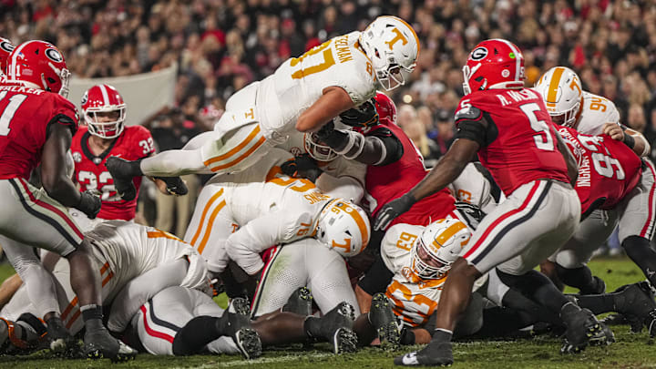 Nov 16, 2024; Athens, Georgia, USA; Tennessee Volunteers tight end Miles Kitselman (87) dives over the goal line for a touchdown against the Georgia Bulldogs during the first quarter at Sanford Stadium. Mandatory Credit: Dale Zanine-Imagn Images