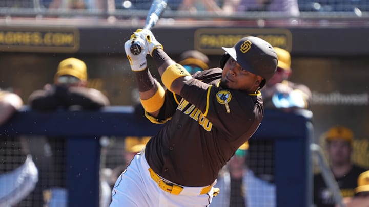 Feb 25, 2025; Peoria, Arizona, USA; San Diego Padres first base Luis Arraez (4) bats against the Los Angeles Angels during the first inning at Peoria Sports Complex. 