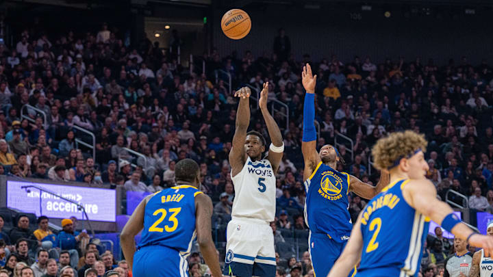 Minnesota Timberwolves guard Anthony Edwards (5) makes a 3-pointer over Golden State Warriors guard Buddy Hield during the second quarter at Chase Center in San Francisco on Dec. 6, 2024. Minnesota Timberwolves guard Anthony Edwards (5) makes a 3-pointer over Golden State Warriors guard Buddy Hield during the second quarter at Chase Center in San Francisco on Dec. 6, 2024.