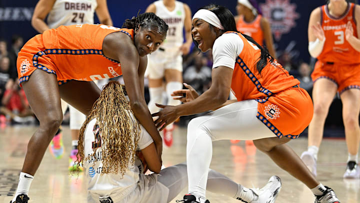 Connecticut Sun forward Aneesah Morrow (24) reacts after battling Atlanta Dream guard Jordin Canada (3) for the ball with guard Mamignan Toure (28) during the second half at Mohegan Sun Arena. Connecticut Sun forward Aneesah Morrow (24) reacts after battling Atlanta Dream guard Jordin Canada (3) for the ball with guard Mamignan Toure (28) during the second half at Mohegan Sun Arena.