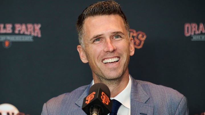 Oct 1, 2024; San Francisco, CA, USA; San Francisco Giants president of baseball operations Buster Posey reacts during an introductory press conference at Oracle Park.  Mandatory Credit: Robert Edwards-Imagn Images