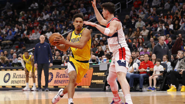 Mar 6, 2022; Washington, District of Columbia, USA; Indiana Pacers guard Malcolm Brogdon (7) drives to the basket as Washington Wizards forward Deni Avdija (9) defends in the first quarter at Capital One Arena. Mandatory Credit: Geoff Burke-USA TODAY Sports Mar 6, 2022; Washington, District of Columbia, USA; Indiana Pacers guard Malcolm Brogdon (7) drives to the basket as Washington Wizards forward Deni Avdija (9) defends in the first quarter at Capital One Arena. Mandatory Credit: Geoff Burke-USA TODAY Sports