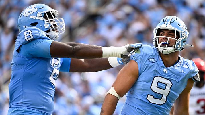 Sep 13, 2025; Chapel Hill, North Carolina, USA; North Carolina Tar Heels defensive lineman Melkart Abou-Jaoude (9 ) celebrates with defensive lineman Smith Vilbert (8) after making a sack in the first quarter at Kenan Stadium. Mandatory Credit: Bob Donnan-Imagn Images Sep 13, 2025; Chapel Hill, North Carolina, USA; North Carolina Tar Heels defensive lineman Melkart Abou-Jaoude (9 ) celebrates with defensive lineman Smith Vilbert (8) after making a sack in the first quarter at Kenan Stadium. Mandatory Credit: Bob Donnan-Imagn Images