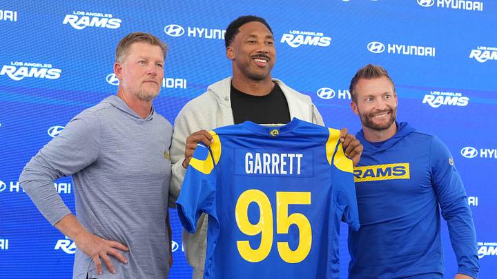 Los Angeles Rams defensive end Myles Garrett poses with general manager Les Snead and coach Sean McVay.