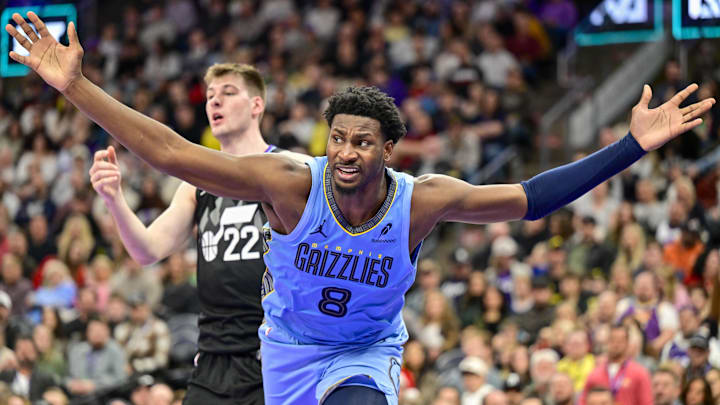 Dec 23, 2025; Salt Lake City, Utah, USA; Memphis Grizzlies forward/center Jaren Jackson Jr. (8) looks for a foul call during the first half against Utah Jazz center Kyle Filipowski (22) at Delta Center. Mandatory Credit: Peter Creveling-Imagn Images