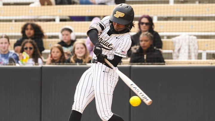 Purdue's Moriah Polar swinging at a pitch.