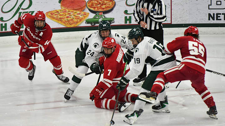 Michigan State and Wisconsin go after the puck in Big Ten action at Munn Arena Saturday, Nov. 22, 2025.