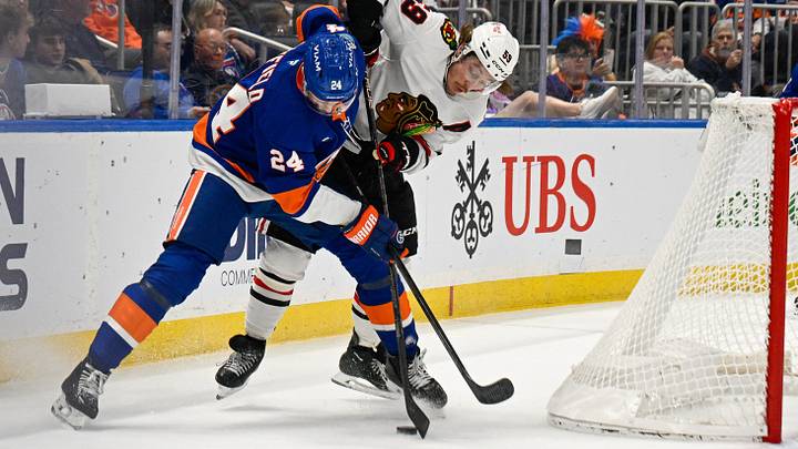 Oct 8, 2026; Elmont, New York, USA; Chicago Blackhawks left wing Tyler Bertuzzi (59) and New York Islanders defenseman Scott Mayfield (24) battle for the puck behind the net during the first period at UBS Arena. Mandatory Credit: Dennis Schneidler-Imagn Images Oct 8, 2026; Elmont, New York, USA; Chicago Blackhawks left wing Tyler Bertuzzi (59) and New York Islanders defenseman Scott Mayfield (24) battle for the puck behind the net during the first period at UBS Arena. Mandatory Credit: Dennis Schneidler-Imagn Images