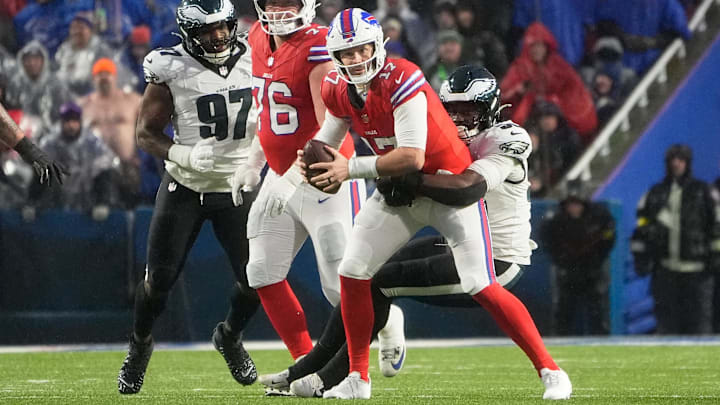 Dec 28, 2025; Orchard Park, New York, USA; Philadelphia Eagles linebacker Jalyx Hunt (58) sacks Buffalo Bills quarterback Josh Allen (17) during the first quarter at Highmark Stadium