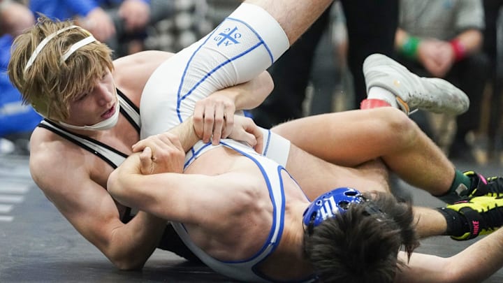 Mariner's Maximus Brady (left) wrestles Jesuit's Nathan McGill in the 126 pound match during the Cradle Cancer Invitational wrestling tournament on Saturday, Jan. 7, 2023, at Jensen Beach High School.

Tcn Wrestling Tourney
