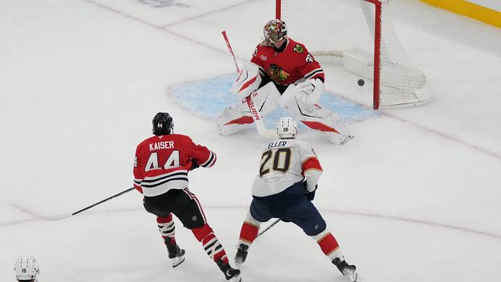 Florida Panthers center Lars Eller (20) scores the game-winning goal on Chicago Blackhawks goaltender Spencer Knight (30) during the third period at United Center.  Mandatory Credit: David Banks-Imagn Images