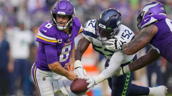 Darrell Taylor strips the ball from former Vikings quarterback Kirk Cousins. Taylor has reportedly been traded to the Bears. Darrell Taylor strips the ball from former Vikings quarterback Kirk Cousins. Taylor has reportedly been traded to the Bears.