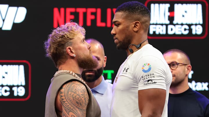 Jake Paul and Anthony Joshua face off after a press conference announcing their heavyweight boxing match at Kayesa Center.