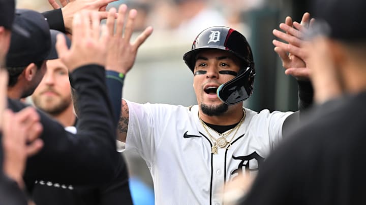 Detroit Tigers shortstop Javier Báez (28) celebrates in the dugout after scoring a run against the Chicago Cubs at Comerica Park. 