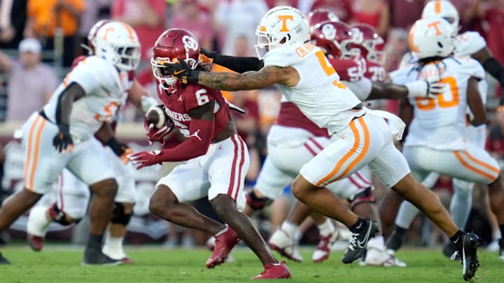 Oklahoma Sooners wide receiver Deion Burks (6) is brought down by Tennessee Volunteers defensive back Christian Harrison (5) during a college football game between the University of Oklahoma Sooners (OU) and the Tennessee Volunteers at Gaylord Family - Oklahoma Memorial Stadium in Norman, Okla., Saturday, Sept. 21, 2024. Oklahoma Sooners wide receiver Deion Burks (6) is brought down by Tennessee Volunteers defensive back Christian Harrison (5) during a college football game between the University of Oklahoma Sooners (OU) and the Tennessee Volunteers at Gaylord Family - Oklahoma Memorial Stadium in Norman, Okla., Saturday, Sept. 21, 2024.