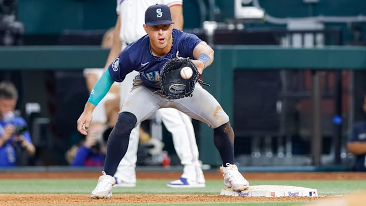 Seattle Mariners utility player Dylan Moore catches a throw to first during a game against the Texas Rangers on Sept. 21 at Globe Life Field. Seattle Mariners utility player Dylan Moore catches a throw to first during a game against the Texas Rangers on Sept. 21 at Globe Life Field.