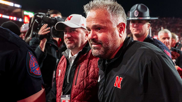 Matt Rhule and athletic director Troy Dannen walk off the field after defeating the Wisconsin Badgers.