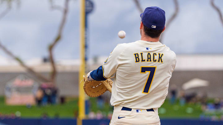 Mar 7, 2025; Phoenix, Arizona, USA;  Milwaukee Brewers infielder Tyler Black (7) throws from first during a spring training game against the San Diego Padres at American Family Fields of Phoenix. Mandatory Credit: Allan Henry-Imagn Images