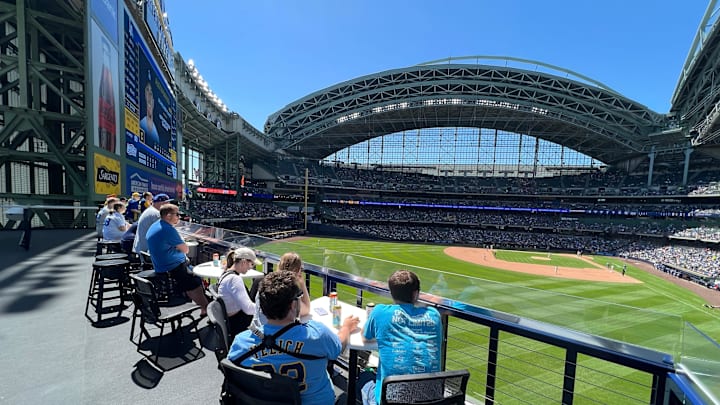 Fans take in a Milwaukee Brewers game from the Miller Lite Landing at American Family Field on May
