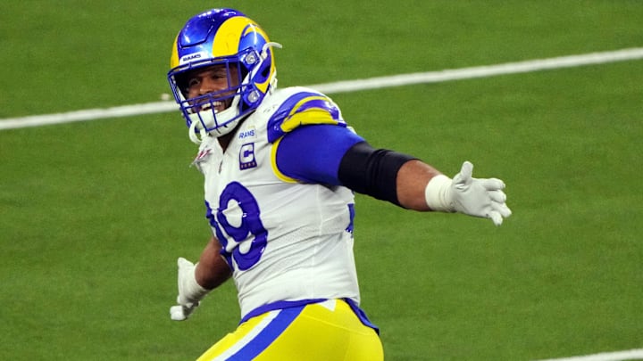 Los Angeles Rams defensive end Aaron Donald celebrates after wrapping up Cincinnati Bengals quarterback Joe Burrow on the final play of the Super Bowl