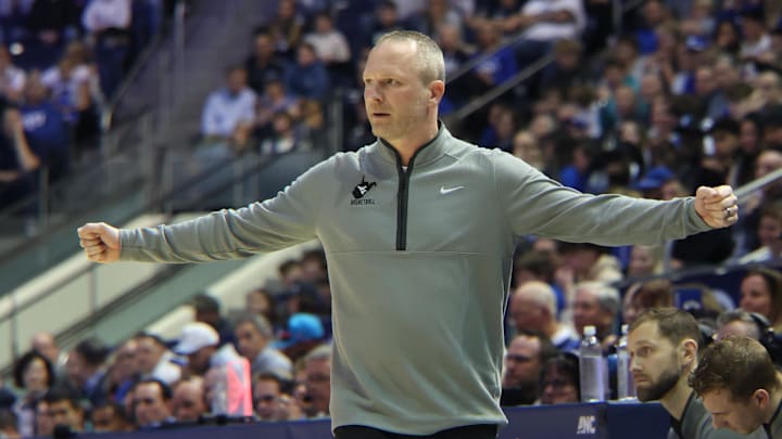 iMar 1, 2025; Provo, Utah, USA; West Virginia Mountaineers head coach Darian DeVries calls a play against the Brigham Young Cougars during the first half at Marriott Center. Mandatory Credit: Rob Gray-Imagn Images