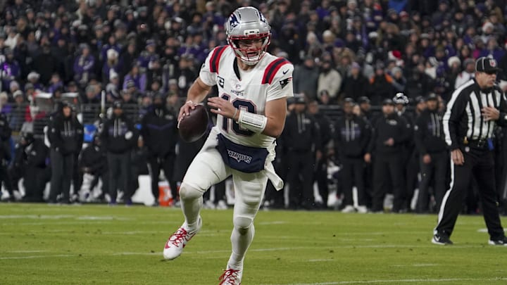 Dec 21, 2025; Baltimore, Maryland, USA;  New England Patriots halfback Drake Maye (10) runs the ball against the Baltimore Ravens during the first half of the game at M&T Bank Stadium. Mandatory Credit: James Lang-Imagn Images