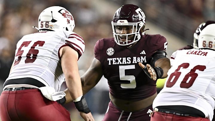 Nov 16, 2024; College Station, Texas, USA; Texas A&M Aggies defensive lineman Shemar Turner (5) defends in coverage against the New Mexico State Aggies during the first half at Kyle Field. Mandatory Credit: Maria Lysaker-Imagn Images 