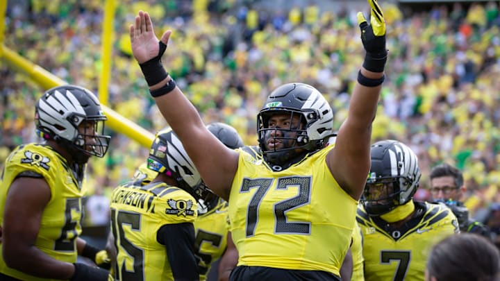 Oregon offensive lineman Iapani Laloulu celebrates a touchdown by Oregon running back Noah Whittington as the No. 1 Oregon Ducks host the No. 21 Illinois Fighting Illini Saturday, Oct. 26, 2024 at Autzen Stadium in Eugene, Ore.