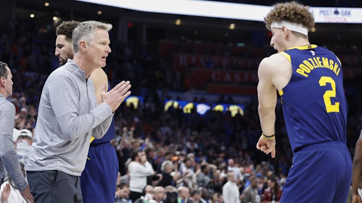 Dec 8, 2023; Oklahoma City, Oklahoma, USA; Golden State Warriors head coach Steve Kerr talks to Golden State Warriors guard Brandin Podziemski (2) during the second half against the Oklahoma City Thunder at Paycom Center. Mandatory Credit: Alonzo Adams-Imagn Images Dec 8, 2023; Oklahoma City, Oklahoma, USA; Golden State Warriors head coach Steve Kerr talks to Golden State Warriors guard Brandin Podziemski (2) during the second half against the Oklahoma City Thunder at Paycom Center. Mandatory Credit: Alonzo Adams-Imagn Images