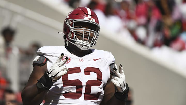 Apr 13, 2024; Tuscaloosa, AL, USA;  Alabama offensive lineman Tyler Booker (52) celebrates after the offense scored a touchdown during the A-Day scrimmage at Bryant-Denny Stadium. Mandatory Credit: Gary Cosby Jr.-Imagn Images