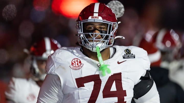 Dec 19, 2025; Norman, OK, USA; Alabama Crimson Tide offensive lineman Kadyn Proctor (74) against the Oklahoma Sooners during the CFP National Playoff First Round at Gaylord Family Oklahoma Memorial Stadium. Mandatory Credit: Mark J. Rebilas-Imagn Images