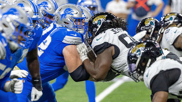 Nov 17, 2024; Detroit, Michigan, USA; Detroit Lions guard Michael Niese (62) defends against Jacksonville Jaguars defensive tackle Jordan Jefferson (98) during the second half at Ford Field. Mandatory Credit: David Reginek-Imagn Images