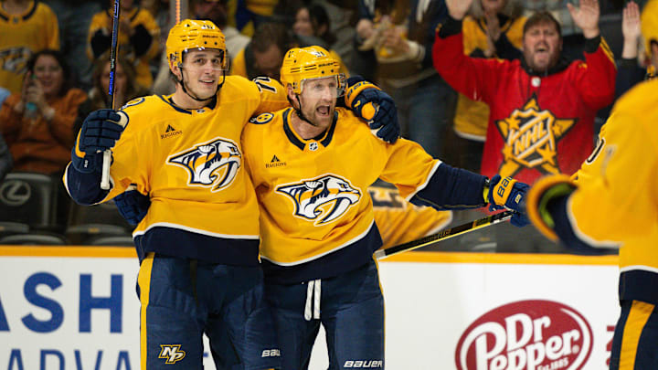 Nov 23, 2024; Nashville, Tennessee, USA;  Nashville Predators center Steven Stamkos (91) celebrates his goal with defenseman Brady Skjei (76) against the Winnipeg Jets during the third period at Bridgestone Arena. Mandatory Credit: Steve Roberts-Imagn Images