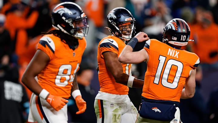 Dec 15, 2024; Denver, Colorado, USA; Denver Broncos wide receiver Courtland Sutton (14) celebrates with quarterback Bo Nix (10) after a touchdown ahead of wide receiver Lil'Jordan Humphrey (84) in the fourth quarter against the Indianapolis Colts at Empower Field at Mile High. 