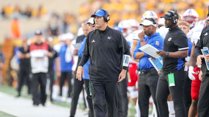 Sep 10, 2022; Morgantown, West Virginia, USA; Kansas Jayhawks quarterbacks coach Jim Zebrowski walks along the sidelines during the second quarter against the West Virginia Mountaineers at Mountaineer Field at Milan Puskar Stadium. Mandatory Credit: Ben Queen-Imagn Images
